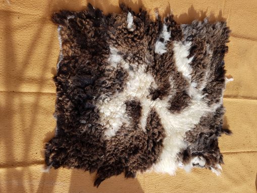 Brown and cream jacob sheep fleece rug
